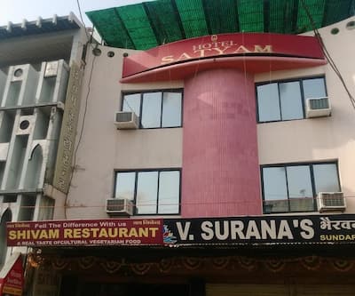 https://imgcld.yatra.com/ytimages/image/upload/t_hotel_yatra_city_desktop/v1450087577/Domestic Hotels/Hotels_Ujjain/Hotel Satyam/FRONT_VIEW.jpg